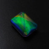 An emerald-cut natural boulder opal of 18.15 carats, certified and brilliant