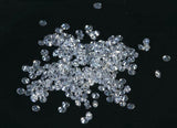 1mm CVD Diamond SI1 DEF Loose Stones scattered on a black surface, showcasing their brilliance and clarity.