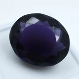 Faceted purple gemstone on a white background