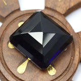 Purple Amethyst Square Cut Gems held in hand scale image