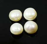 A set of four white, round Shape natural pearl gemstones against a black background.