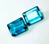 Certified Aquamarine Loose Gemstone Pair, emerald cut on white background