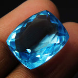Natural Ocean Blue Aquamarine Gemstone Displayed on Finger - Certified and Clarity Enhanced