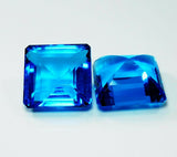 Loose Ocean Blue Aquamarine Gemstones Displayed on White Surface - GIR Certified Pair