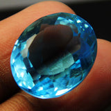 Oval Aquamarine Gemstone Displayed on Two Fingers - Ocean Blue, Certified and Translucent