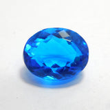 A loose, oval-cut, natural light blue sapphire gemstone weighing 17.70 carats.
