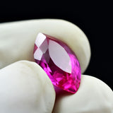 Gloved Hand Holding 6.90 Ct Natural Pink Ruby Certified Marquise Gemstone from Mozambique