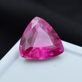 9.35 Ct Trillion Cut Natural Pink Ruby Resting on White Display Surface with Black Backdrop – Certified Loose Gemstone