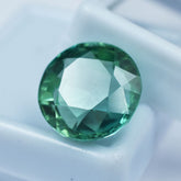 Certified natural Montana sapphire, 12.55 ct round cut.