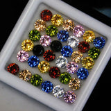 Assorted colored gemstones in a white display case.