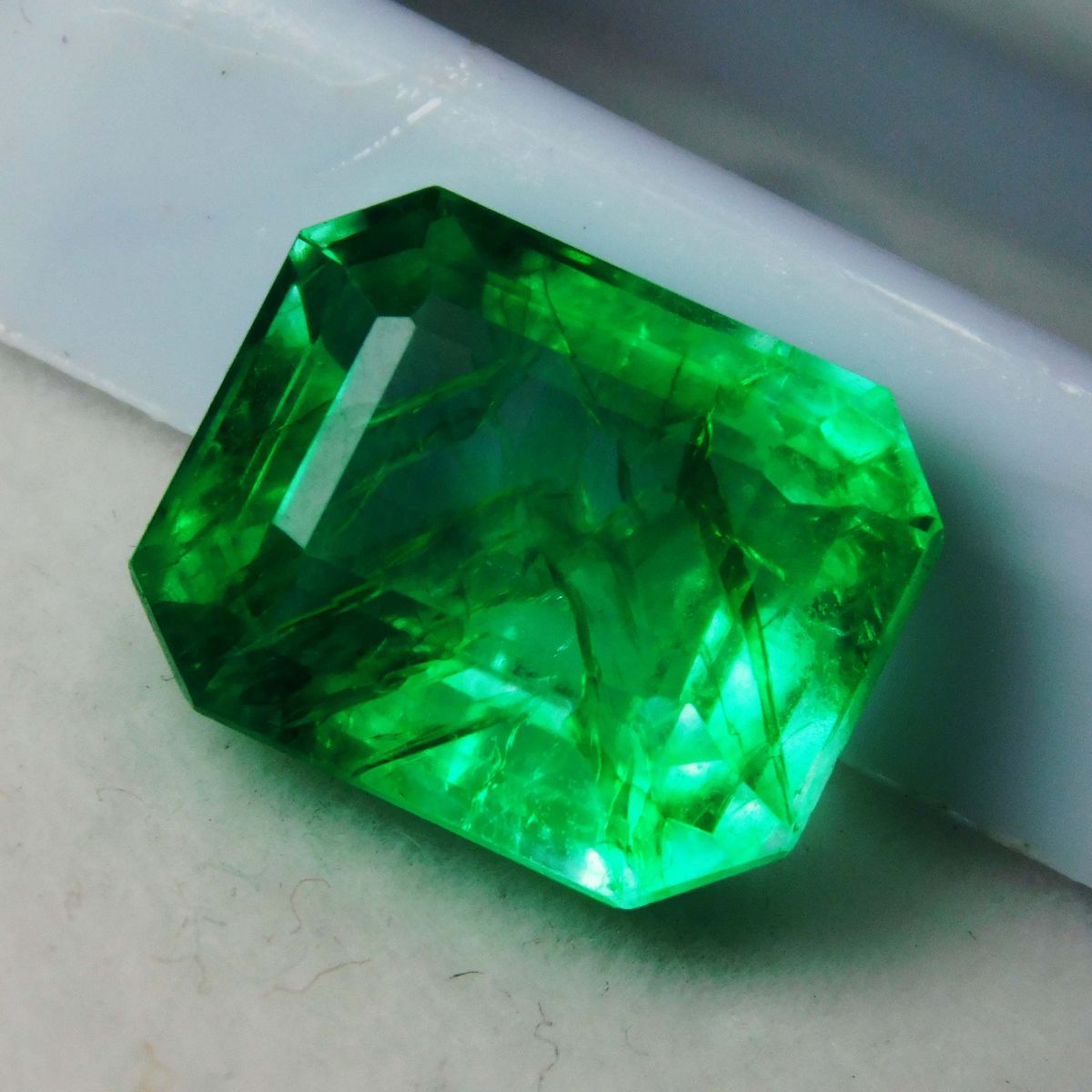 Brighter view of emerald gemstone under light reflection