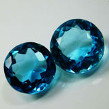 16.58 Ct Ocean Blue Aquamarine Round Cut Gemstone Pair on White Background - Certified and Eye Clean