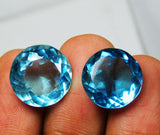 Aquamarine Round Cut Loose Gemstone Pair Displayed on Hand - Natural and Clarity Enhanced