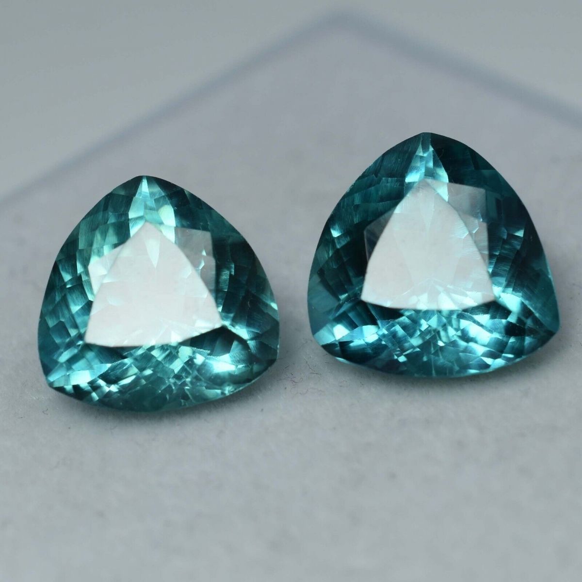 Natural grandidierite pair, trillion cut, 14.95 ct total, bluish-green, certified.