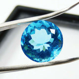 Blue Aquamarine Round Gemstone Held by Jewel Tool – 10 Carat Natural Stone