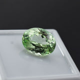 Bluish-green natural grandidierite, certified 5.20 ct oval cut gemstone.