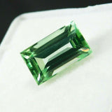 Natural Montana sapphire gemstone, 3.40 ct baguette shape in bluish-green, certified.