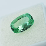 Certified 7.40 ct natural grandidierite, bluish-green cushion cut gemstone.