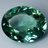 Natural Montana sapphire gemstone, 11.25 ct oval cut bluish-green, certified