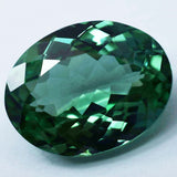 Loose certified Montana sapphire, 17.25 ct bluish-green oval cut natural gemstone.