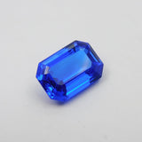 Translucent Blue Tanzanite Loose Gemstone 17.60 Carat – Emerald Cut on White Background