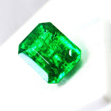 Close-up image of the emerald with crystal-clear focus, revealing its internal clarity and professional cutting.