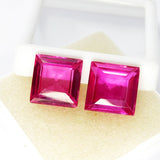 Identical view of pink ruby square cut pair placed on white cushion box – 33.80 Ct