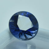 Natural Round Blue Tanzanite Gemstone 6.30 Carat Display on White Surface