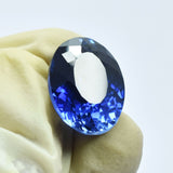 Natural 12.85 Ct Blue Tanzanite Oval Gemstone Displayed in Hand
