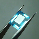 Blue Aquamarine Gemstone 10 Carat Lab Created Emerald Cut Held in Gem Tool Certified