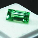 Loose 5.26 ct bluish-green grandidierite, natural baguette cut gemstone, certified quality.