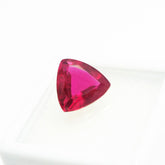 4.75 carat red ruby in trillion cut placed at center on white background – certified natural loose gemstone