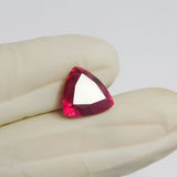 4.75 carat red ruby in trillion cut placed at center on white background – certified natural loose gemstone