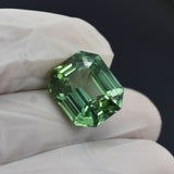 Certified natural grandidierite gemstone, emerald shape, bluish-green, 12.32 carats, loose stone