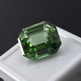 Natural bluish-green grandidierite gemstone, certified emerald cut, 12.32 ct, loose stone.