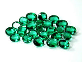 Certified emerald lot displayed from top view with various shapes