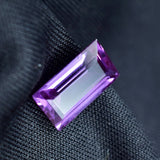 3.70 Ct Baguette Cut Purple Tanzanite Loose Gemstone Held in Hand – Certified from Tanzania