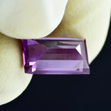 Close-up of Certified Purple Tanzanite Baguette Cut Gemstone 3.70 Ct in Hand
