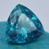 Loose trillion cut sapphire, 13.75 ct natural gemstone, bluish-green, certified quality.