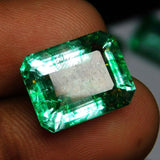 Close-up view of one emerald held between two fingers – Natural Eye Clean Emerald Gemstone