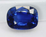 Loose 10.50 Carat Blue Tanzanite Cushion Cut Gemstone on White Surface - GIR Certified