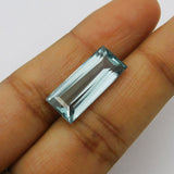 11.60 Carat Aquamarine Gemstone Baguette Shape Held Between Fingers Eye Clean Certified