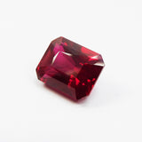 Certified natural red ruby emerald cut, tilted view showing gemstone depth and shine – 13.80 Ct loose gemstone