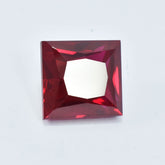 Natural square cut red ruby gemstone, 17.40 carat, certified and clarity enhanced – placed on a plain white background
