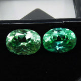 Natural bluish-green grandidierite gemstones, certified oval cut, loose pair, 16 ct total.