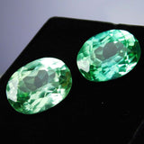 Natural bluish-green grandidierite gemstones, certified oval cut, loose pair, 16 ct total.