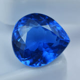 A certified, excellent quality, natural blue sapphire gemstone weighing 9.00 carats and cut into a pear shape.