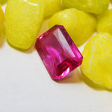 Emerald Cut Natural Ruby - Pink Red Loose Gemstone Held by Glove
