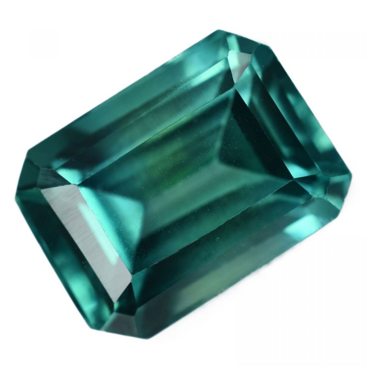 Loose emerald cut Montana sapphire, 8.56 ct, natural bluish-green gemstone, certified quality.