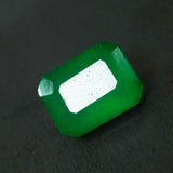 Green gemstone on a dark background